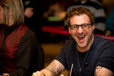 Comedian Patrick Huard laughting at poker tournament